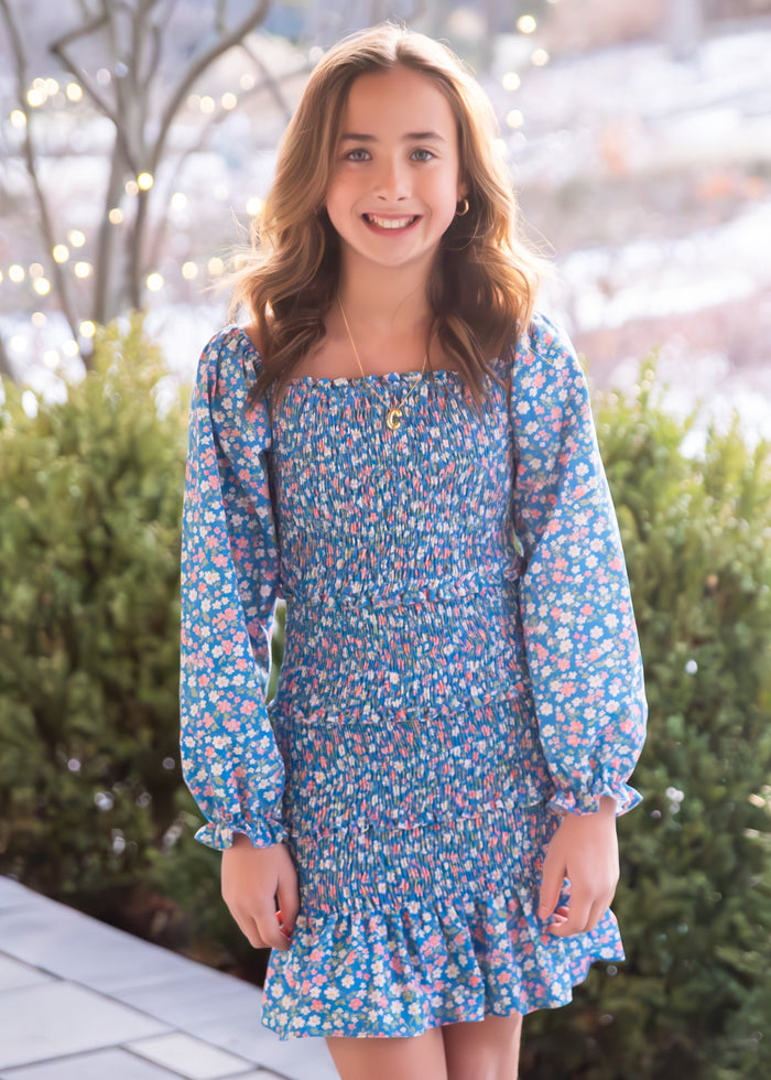 This Fall Floral Smocked Dress by Be Elizabeth combines charming floral patterns with a comfortable smocked design, making it a perfect choice for tweens. Its stylish fit enhances movement and confidence, while the vibrant print adds a touch of seasonal elegance. Ideal for everyday wear or special occasions, this dress is sure to become a favorite in her wardrobe.