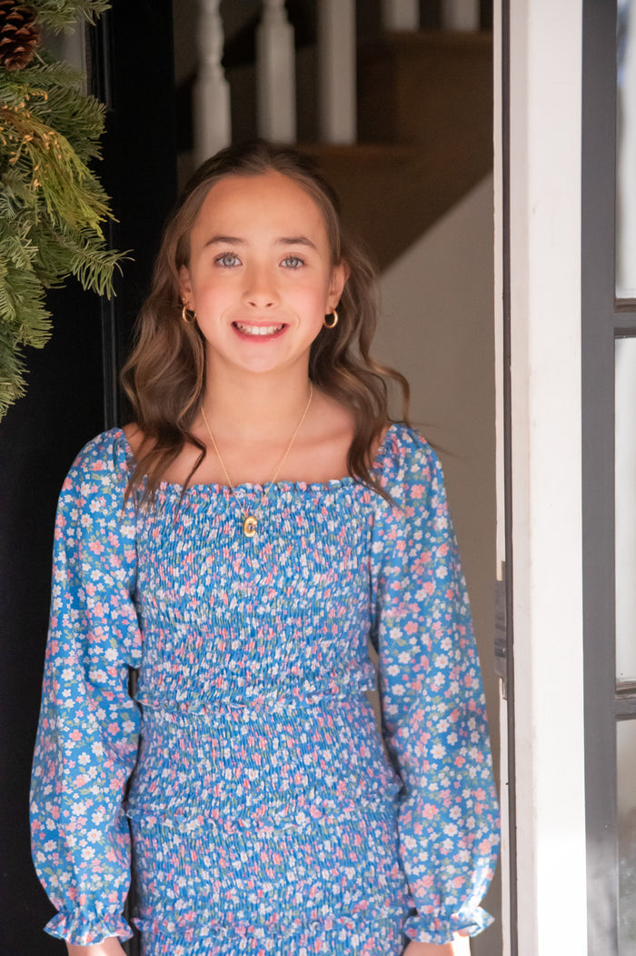 This Fall Floral Smocked Dress by Be Elizabeth combines charming floral patterns with a comfortable smocked design, making it a perfect choice for tweens. Its stylish fit enhances movement and confidence, while the vibrant print adds a touch of seasonal elegance. Ideal for everyday wear or special occasions, this dress is sure to become a favorite in her wardrobe.