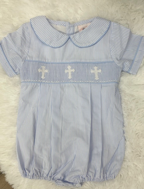 Add a touch of classic style to your little gentleman's wardrobe with the Heintz Cross Bubble from Shop Teeta! This charming bubble features a peter pan collar, blue and white pinstripes, and smocked detailing with white crosses. Perfect for Easter Sunday or any religious event, this bubble will have your little one looking sharp and stylish!